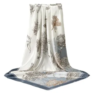 Elegant floral print satin square scarf with silk-like texture and blue border design