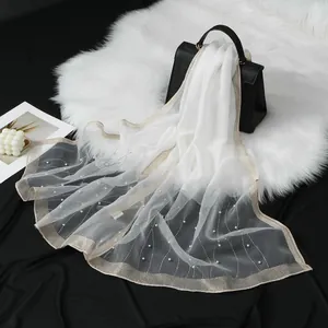 Elegant white organza scarf featuring rhinestone wave patterns and delicate pearls.