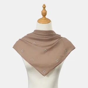Elegant brown square scarf featuring sparkling rhinestone flower patterns on a mannequin