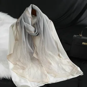 Macro detail of elegant organza scarf with small pearls and glittery wave edges for evening dresses
