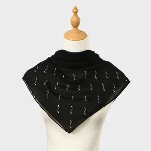 Close-up of elegant black sheer square scarf with sparkling wavy rhinestone patterns