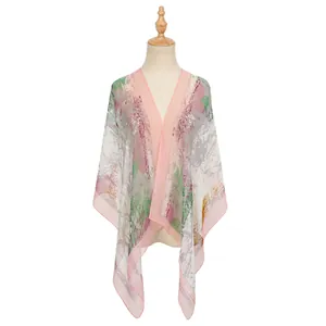 Close-up detail of a lightweight printed georgette shawl with abstract pink patterns