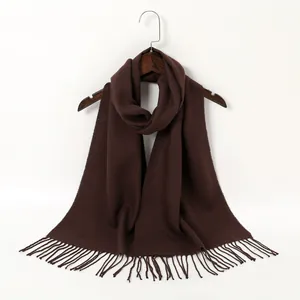 Close-up of a dark brown imitation cashmere scarf with elegant fringe detail