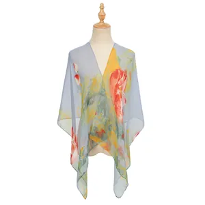 Elegant sheer georgette shawl with vibrant red and yellow floral print on a light blue base