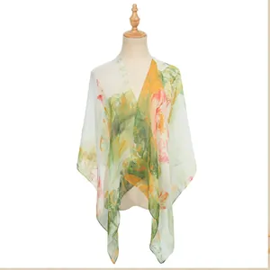 Close-up detail of a lightweight floral georgette shawl draped on a female mannequin.