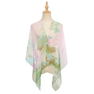 Detail view of lightweight floral georgette shawl on mannequin, breathable pink and green print