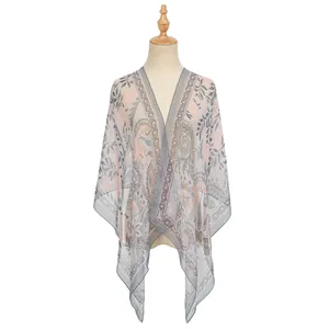 Detail view of a lightweight printed georgette shawl with paisley floral patterns