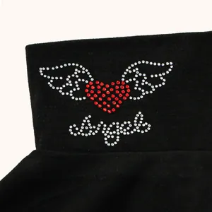 Detail view of red heart and angel wings rhinestone design on black warm fake collar