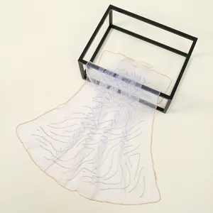 Detailed view of elegant polyester scarf featuring shimmering rhinestone wavy patterns