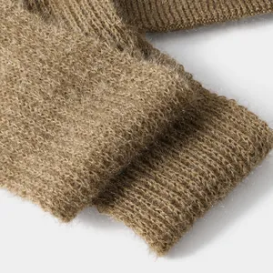 Macro detail of brown squirrel hair knit fabric showing warm and soft fuzzy texture