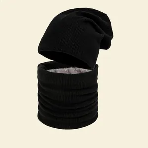 Warm black knitted beanie and snood set with thick fleece lining for cold winter days
