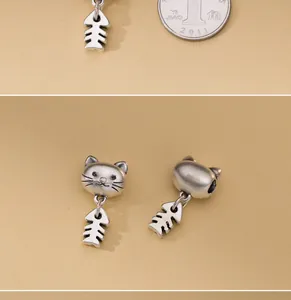 Gedetailleerd overzicht van retro zilveren kat- en visgraatbedels voor doe-het-zelf sieraden.