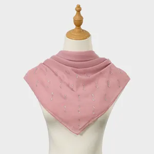 Close-up of pink breathable chiffon square scarf with elegant rhinestone patterns