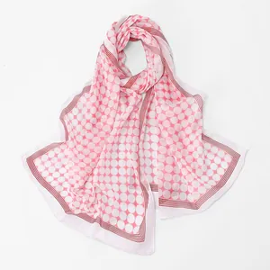Detailed view of pink and white polka dot chiffon scarf with elegant striped borders