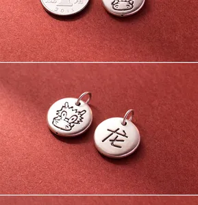 Close-up of 999 fine silver dragon zodiac pendant for DIY jewelry making