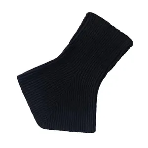 Macro view of black ribbed knit neck gaiter showing detailed wool texture for warmth
