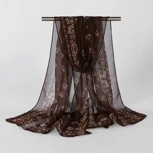 Detailed view of brown sheer georgette long scarf featuring vintage paisley floral print