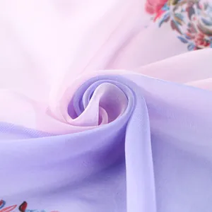Detail macro shot of lightweight pink and lavender floral georgette fabric texture scarf