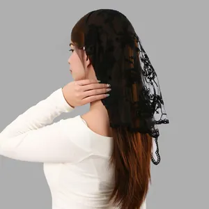 Side view detail of a black floral embroidered lace mantilla veil worn by a model