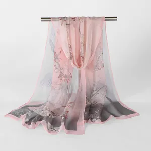 Close-up detail of floral print Georgette scarf in elegant pink and grey gradient