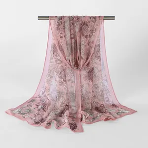 Detail of pink floral Georgette scarf with elegant sheer texture and drape.
