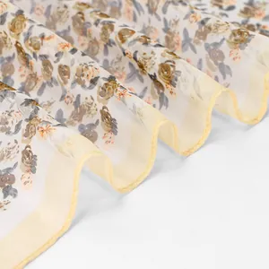 Close-up of lightweight floral georgette scarf with elegant ruffled yellow edges