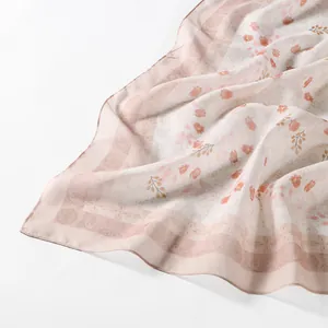 Elegant floral print Bali voile square scarf with soft peach flower patterns and border