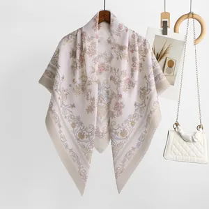 Elegant floral Bali yarn square scarf in soft pink with scalloped edge detail.