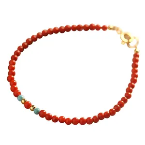 Natural red Nan Hong agate bracelet with auspicious cloud clasp and turquoise accents.