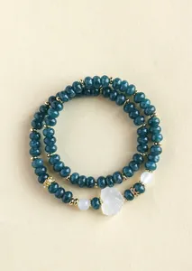 Detailed view of teal chalcedony double-layer beaded bracelet with a white fox charm