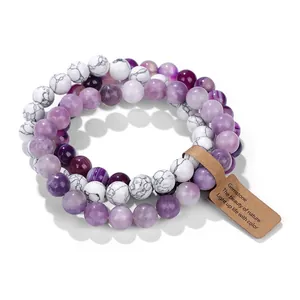 Close-up of a three-layer natural stone beaded bracelet set with amethyst and white turquoise