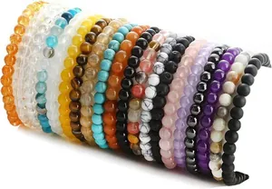 Detailed view of colorful natural stone beaded stretch bracelets stacked together