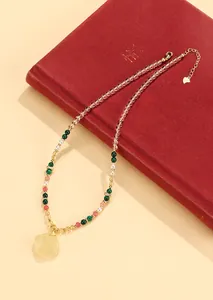 Detailed view of a New Chinese style beaded necklace with a pale yellow pendant