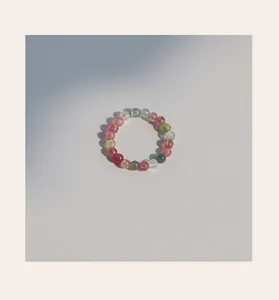 Close-up view of 3mm natural rainbow tourmaline bead ring showing colorful stone details