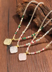 Detail shot of New Chinese style beaded necklaces featuring carved crystal pendants.