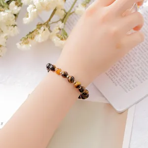 Elegant natural tiger's eye beaded bracelet for women with golden spacer accents
