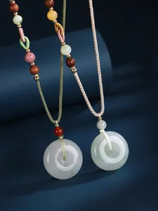Detail of Tianshan Jade and White Agate Ping'an buckle necklace with braided rope