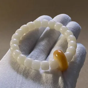 Bracciale autentico in grani di radice di Bodhi bianca con grano d'accento giallo