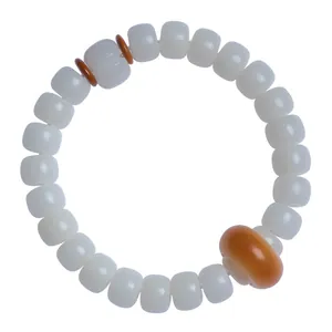 Elegante bracciale in radice di bodhi di giada bianca con perla distanziatrice ambrata.