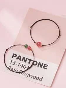 Minimalist handmade braided rope bracelets featuring natural strawberry quartz beads pink