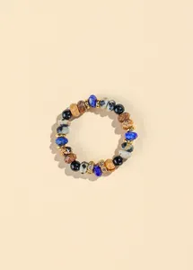 Detailed macro view of 4mm natural lapis lazuli and black agate beaded elastic ring