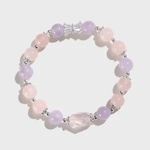 Close-up detail of 8mm amethyst and rose quartz beaded bracelet with silver accents