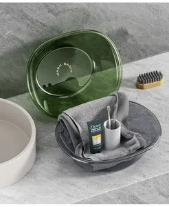 Detailed view of luxury transparent grey and green washbasins in a modern bathroom
