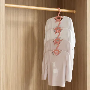 Pink non-slip children's clothes hangers with space-saving linking feature in wardrobe