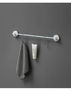 Detail view of durable stainless steel hanging clips on a bathroom towel rack bar