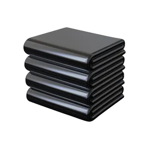 Large black commercial trash bags stacked neatly for heavy duty waste management