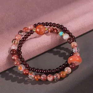Handmade double-loop strawberry quartz and garnet beaded bracelet with a donut charm