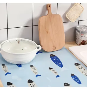 Detail showing waterproof blue kitchen liner with fish pattern in a kitchen setting