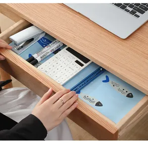 Moisture-proof blue drawer liner with cute cartoon fish pattern in a desk drawer
