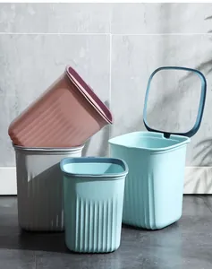 Group of square striped trash cans in pastel blue, pink and grey colors